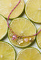 Colorful cord necklace with varying pendants and fish pendant