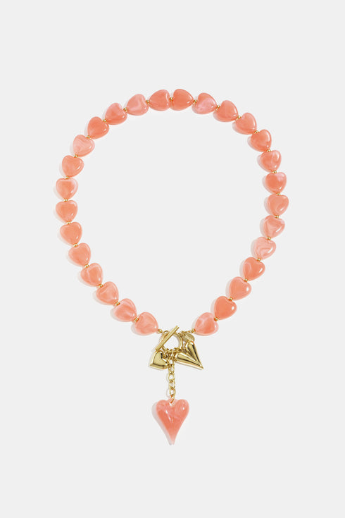 Bead necklace with hanging heart charms